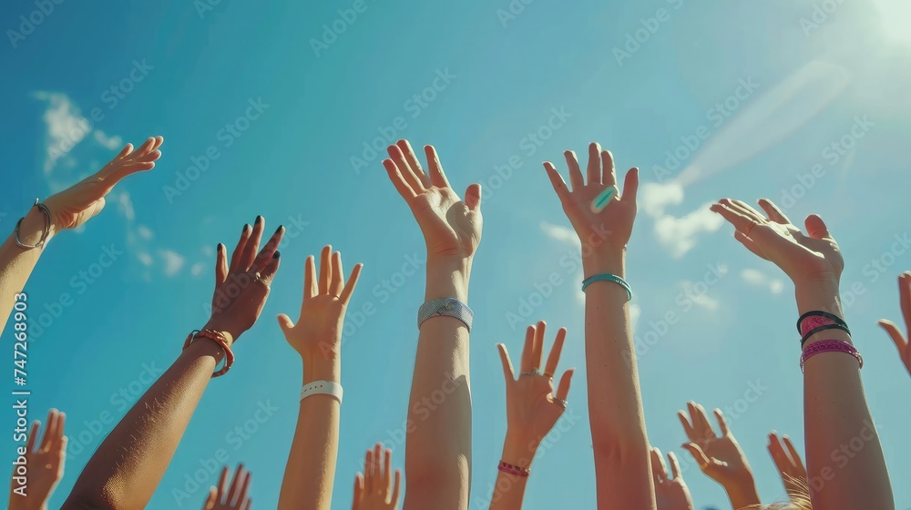 Close up many female hands raised up against blue sky. Friendly team. Gestures, symbols and signs. Participation in public vote. Swing arms to beat of music in dance. Sunny summer outdoor nature. - obrazy, fototapety, plakaty 