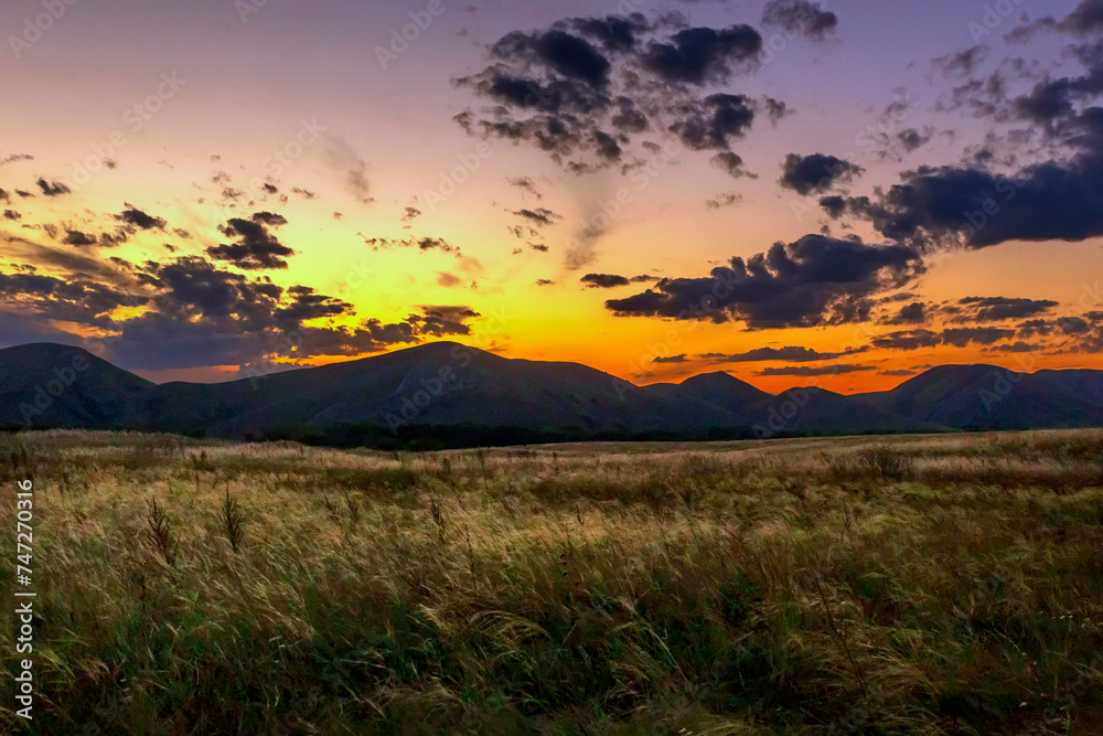 beautiful Karamuruntau mountain range in the Southern Urals in the Orenburg region in the evening illumination beautiful Karamuruntau mountain range in the Southern Urals in the Orenburg region in the evening illumination