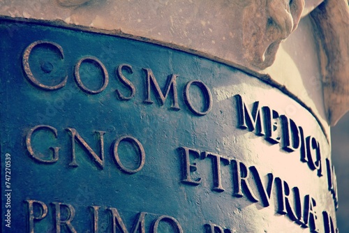 Writing under the statue of Cosimo de Medici, Piazza della Signoria, Florence, Tuscany, Italy photo