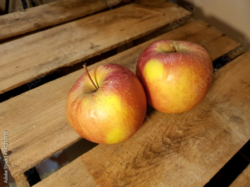 Two fresh apples close together.