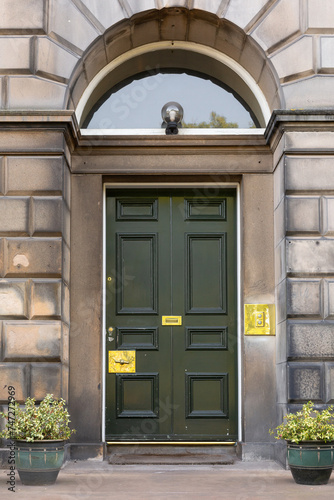 Old Georgian stone townhouse door with fanlight window above door