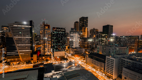 Captivating twilight scenery of the BGC business district skyline in Metro Manila with illuminated buildings.