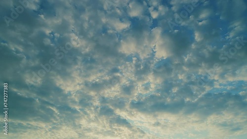 Cirrocumulus with ray light effects. Morning sunset blue sky with wispy smoke cirrocumulus. photo