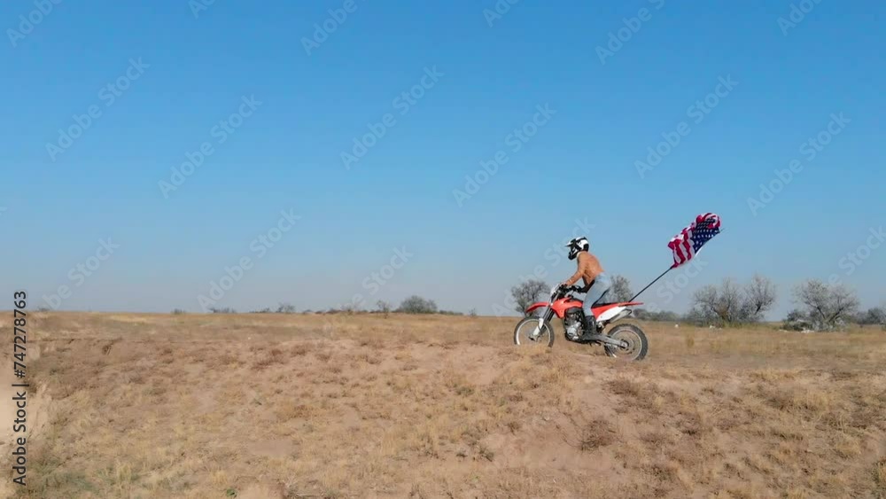 A female racer is engaged in extreme sports on an enduro motorcycle. Motorsports in the USA. A female racer is engaged in extreme sports on an enduro motorcycle. Motorsports in the USA.