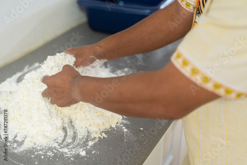 Midsection of woman preparing flour for meal