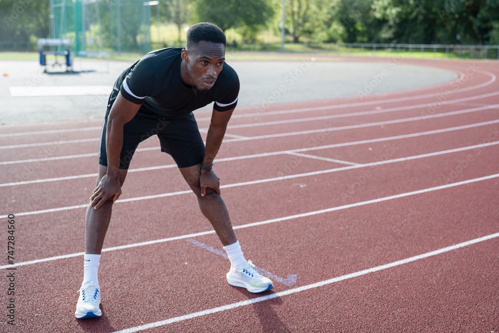 Athlete training at sports track