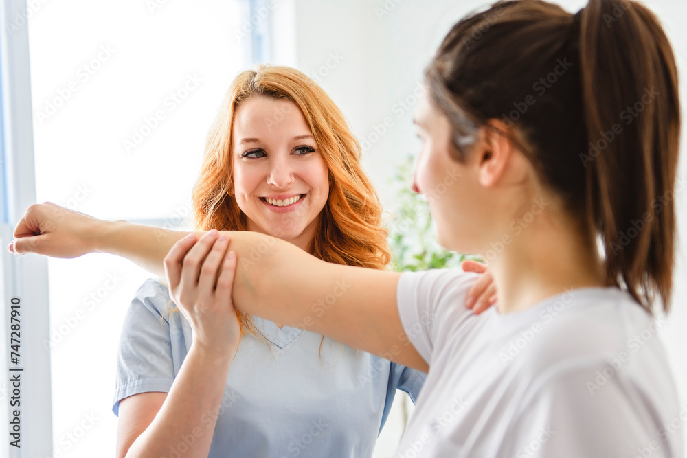Fototapeta premium Modern rehabilitation physiotherapy at work with client
