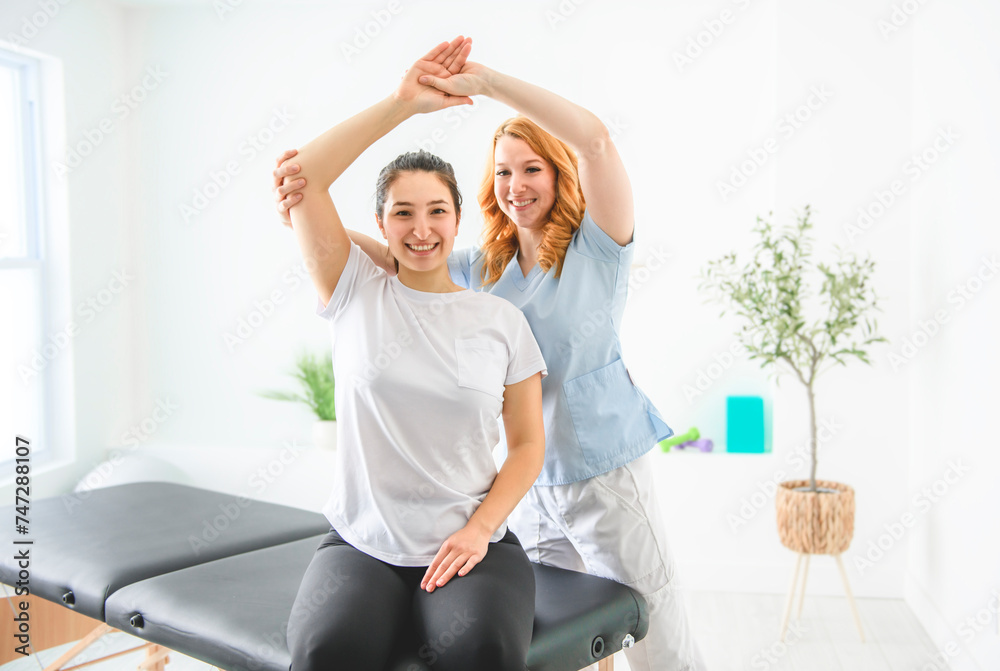 Modern rehabilitation physiotherapy at work with client Modern rehabilitation physiotherapy at work with client