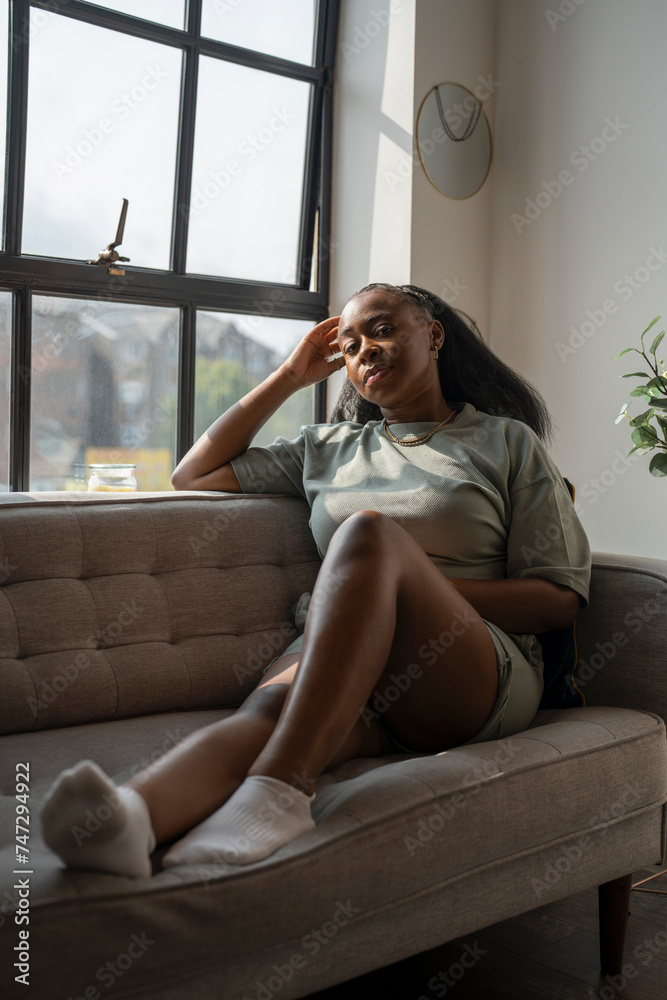 Portrait of young woman resting on sofa at home Portrait of young woman resting on sofa at home