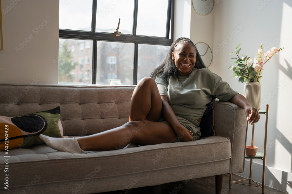 Portrait of young woman resting on sofa at home Portrait of young woman resting on sofa at home