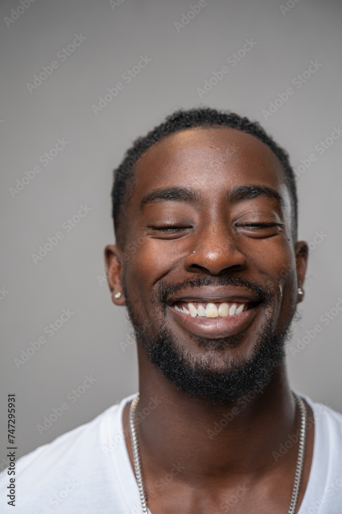 Portrait of smiling man with closed eyes Portrait of smiling man with closed eyes