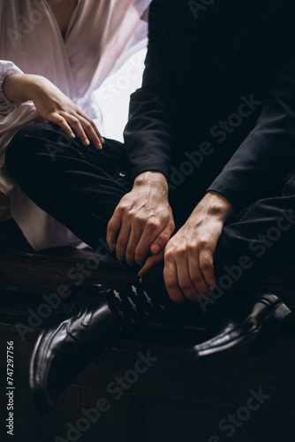 close up of a couple holding hands together