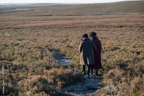 Two senior women hiking in landscape