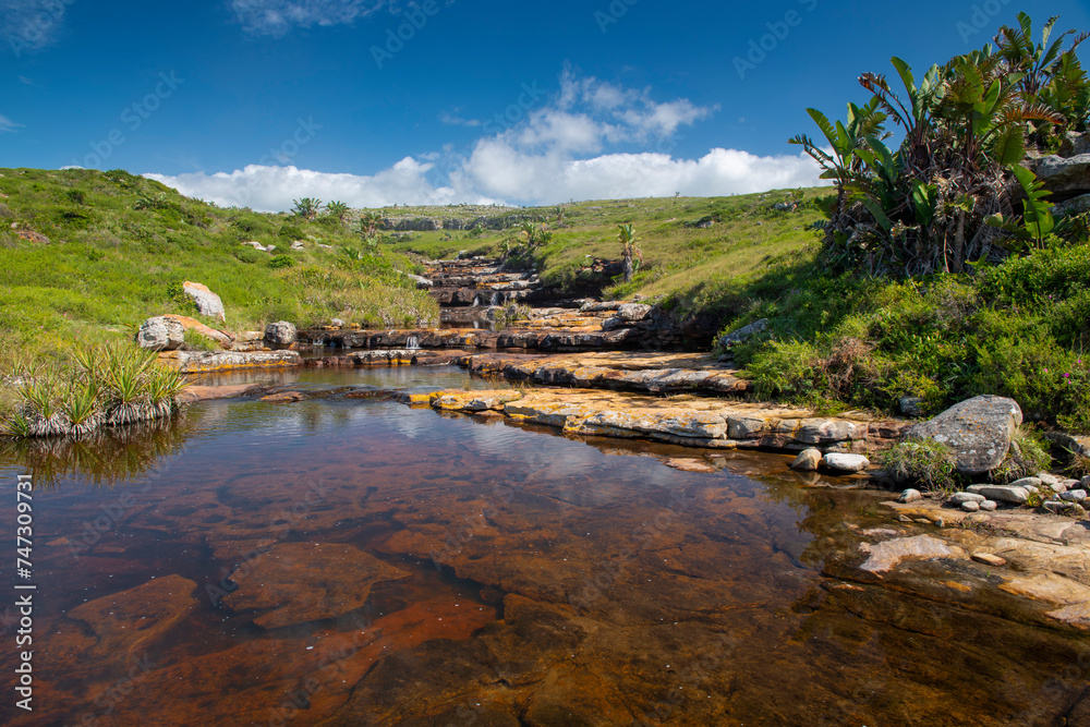 The Wild Coast, known also as the Transkei, is a 250 Kilometre long stretch of rugged and unspoiled Coastline that stretches North of East London along sweeping Bays, footprint-free Beaches, lazy Lago