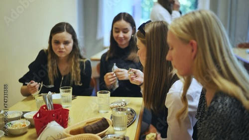 Senior girls having breakfast in the school canteen. photo