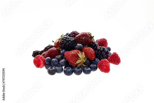 A pile of mixed fresh berries isolated on a white background