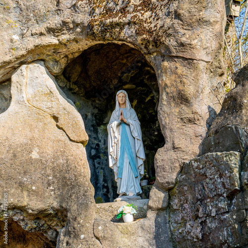 Figurine of the Virgin in an artificial Lourdes grotto
