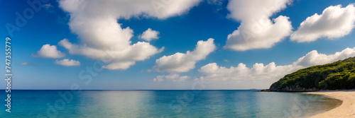 Panorama of a beautiful tropical beach with crystal clear water and blue sky