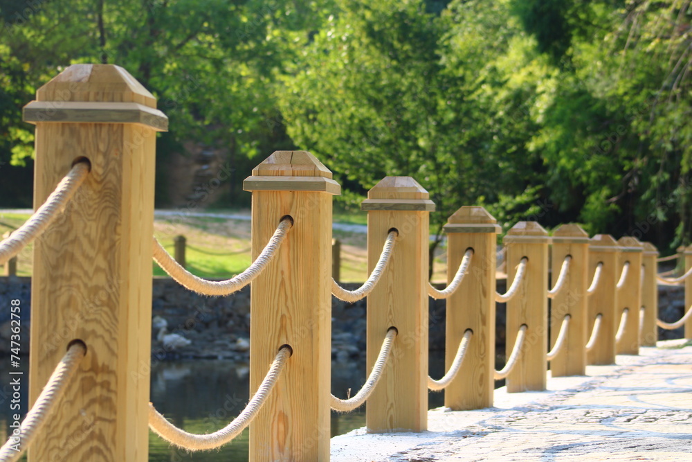 Obraz premium rope railing made of wood. wooden fence