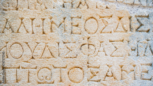 Close-up  background of ancient Greek writings on the ruins of an ancient city