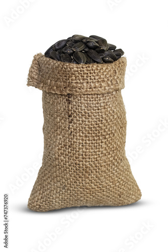 Black sunflower seeds in a jute bag isolated on a transparent background.