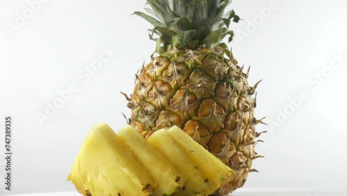 Sweet, juicy, ripe yellow pineapple and its slices