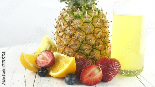 A pineapple. Fruit and berry salads. Juicy ripe slices.