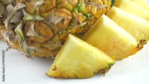 A pineapple. Fruit and berry salads. Juicy ripe slices.