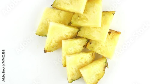 A pineapple. Fruit and berry salads. Juicy ripe slices.