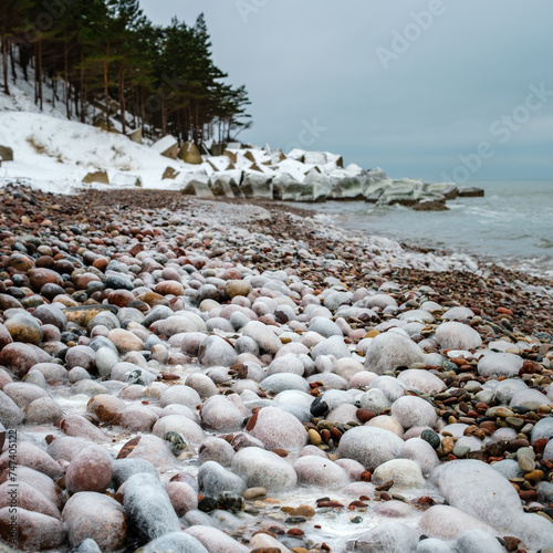 Rocky Resilience: Braving the Winter Beach, Uzavas Baka, Latvija photo