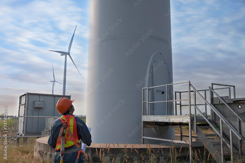 custom made wallpaper toronto digitalmaintenance engineer standing against turbines on wind turbine farm.