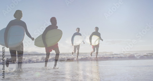 Image of african american couple over african american couple with surfboards at beach