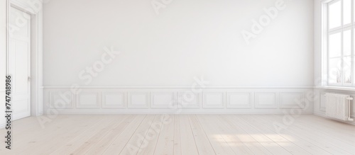 A white empty room with a window and a radiator, typical of Scandinavian interior design. The room is minimalistic with a focus on functionality and simplicity.