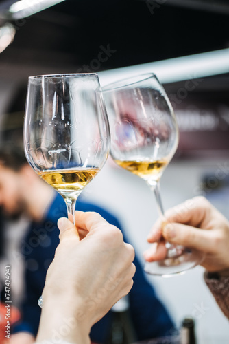 Photography Wine Enthusiasts Evaluating Wine at a Trade Fair