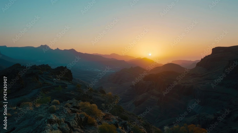 Beautiful sunset scene over distant mountains, perfect for nature backgrounds