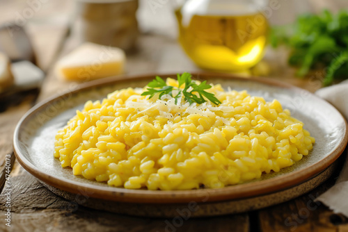 A plate of risotto alla milanese, a creamy rice dish from Milan made with saffron, butter, and Parmesan cheese photo