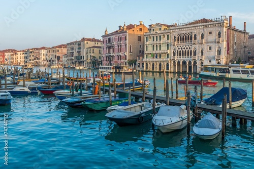 Small boats at pier in Venice, Italy © Xavier Allard