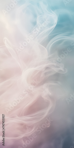 Close-up photograph of delicate wisps of smoke gently unfurling against a background of soft, pastel hues.