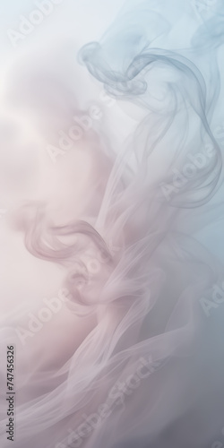 Close-up photograph of delicate wisps of smoke gently unfurling against a background of soft, pastel hues.