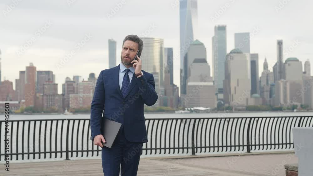 Man phone conversation in city. Businessman talking on phone. Hispanic business man with phone in Manhattan. Businessman using mobile. Business conversation. Businessman using phone. Copy space Man phone conversation in city. Businessman talking on phone. Hispanic business man with phone in Manhattan. Businessman using mobile. Business conversation. Businessman using phone. Copy space
