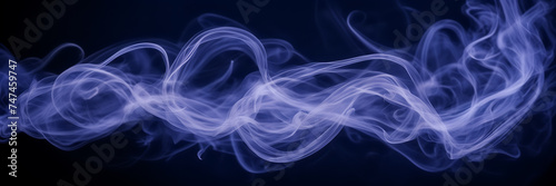 Photograph capturing the mesmerizing dance of lavender smoke tendrils against a canvas of midnight blue. © Hans