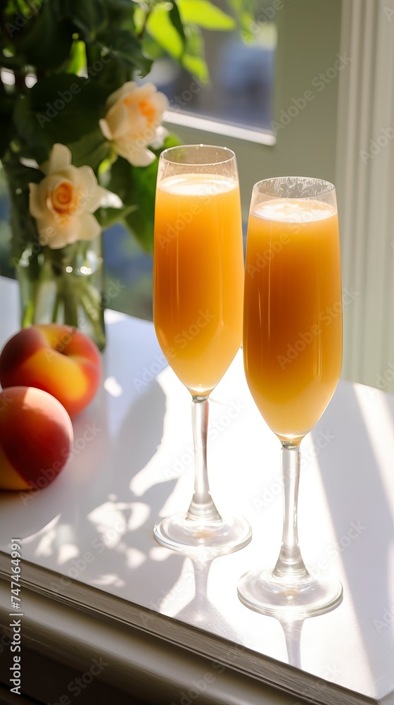 Peach Bellini drinks on a Table with Beautiful Lighting Peach Bellini drinks on a Table with Beautiful Lighting