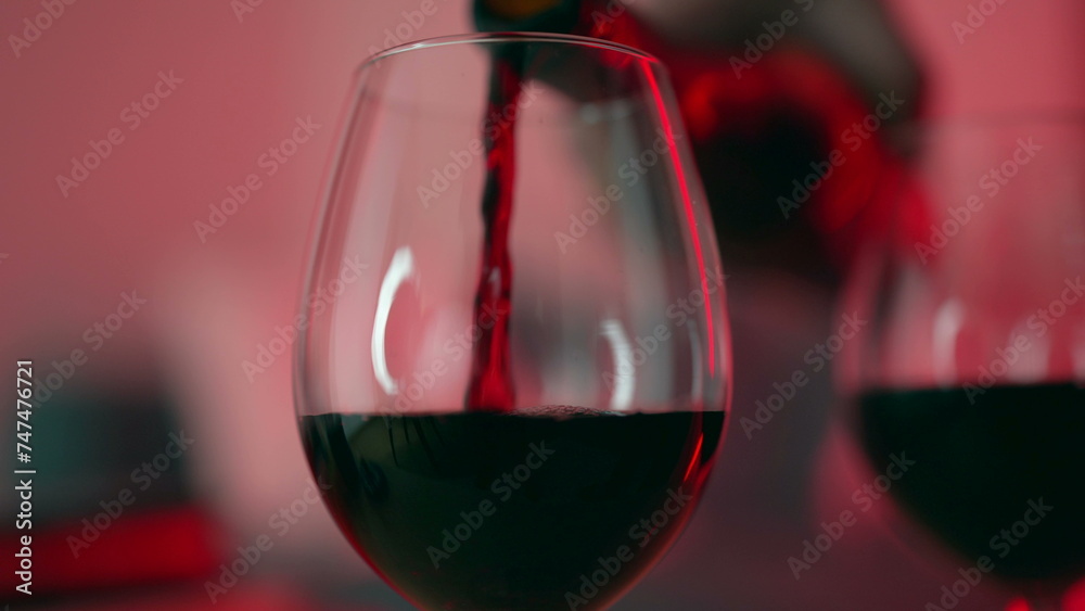 Red Wine Pour for Evening Celebration, Moderation and Elegance. Serving alcoholic drink