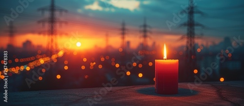 Burning flame candle and power lines on background photo