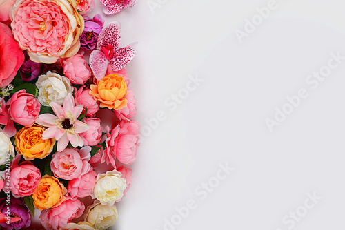 Beautiful flowers and butterflies on a light background.Abstract floral composition, still life, spring background or banner, holiday concept. Card for Mother's Day, Women's Day, Happy Birthday #747478512