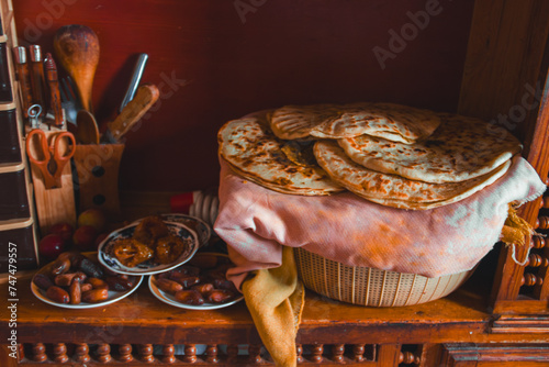 Comida típica marroquí preparada para la cena de Ramadán. Dátiles y pan en una cocina. photo