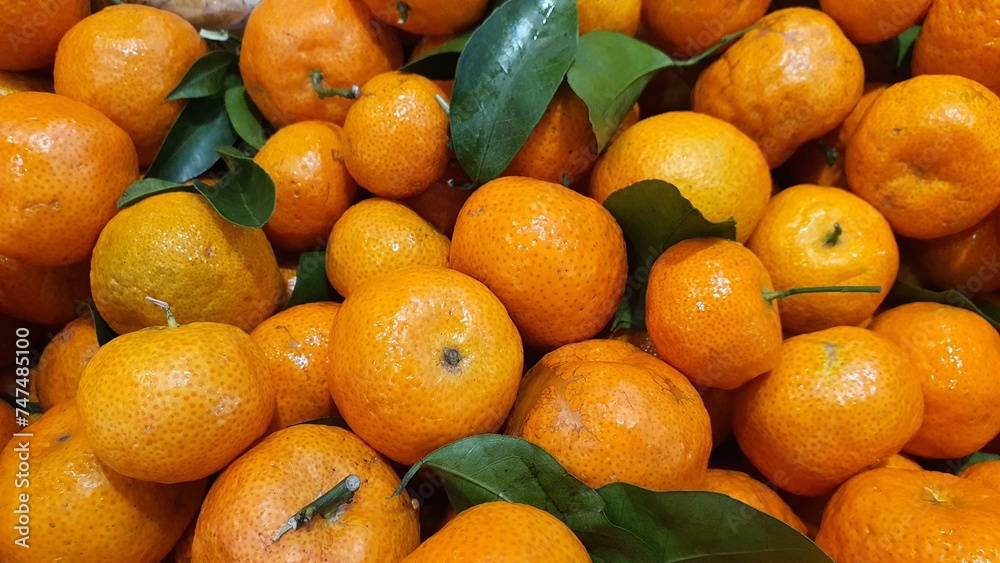 Close up pile of tasty fresh oranges sold at the market as a background. Close up pile of tasty fresh oranges sold at the market as a background.