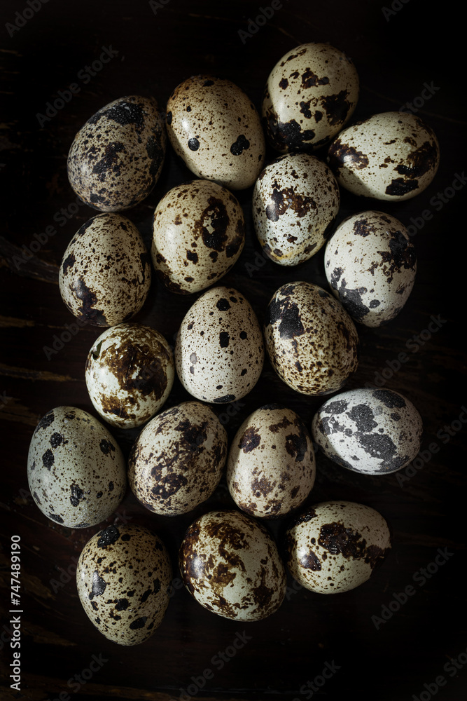 Quail eggs with one broken showing shell texture Quail eggs with one broken showing shell texture