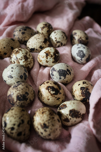 Quail eggs with one broken showing shell texture