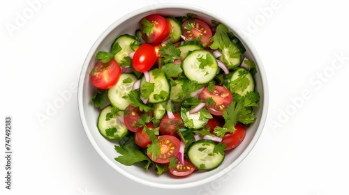 Bowl with delicious vegetable salad on white background, top view